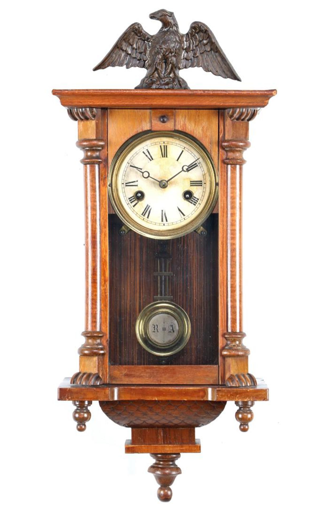 Regulator in walnut cabinet with eagle on top