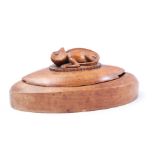 Oval walnut lidded container with reptile on lid