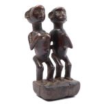 Cermonial wooden statue of a man and woman