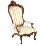 Mahogany richly decorated voltaire with classic upholstery