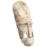 Wooden ceremonial mask decorated with white kaolin