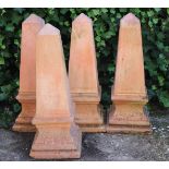 4 terracotta obelisk ornaments