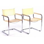 2 tubular frame armchairs