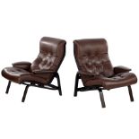 2 brown padded leather armchairs
