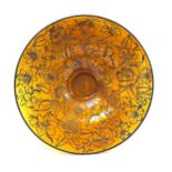 Ocher-coloured round glass bowl