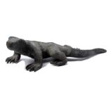 Bronze statue of a monitor lizard