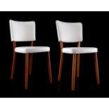2 white skaile leather chairs