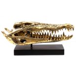 Bronze sculpture of a saltwater crocodile skull