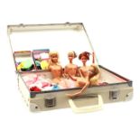 Suitcase with 4 Barbies