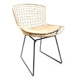 Gold colored metal wire chair
