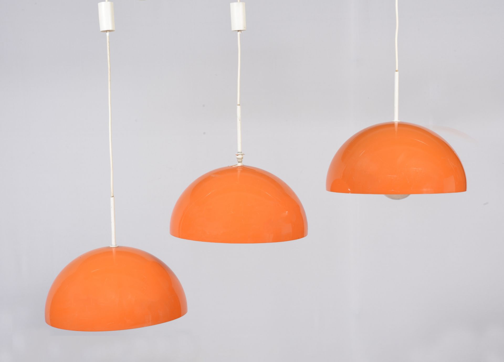 THREE ORANGE PVC SUSPENSIONS