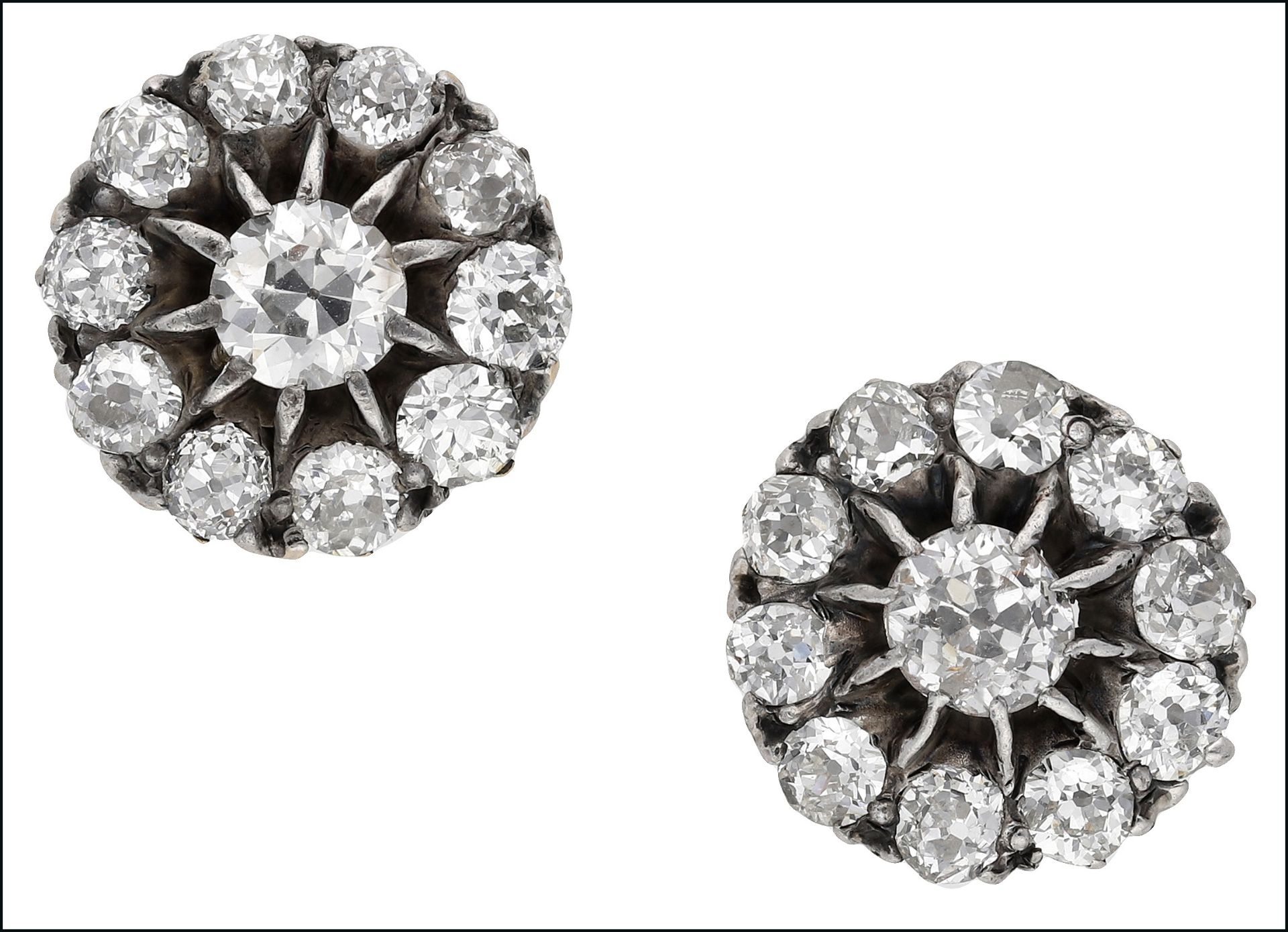 A pair of diamond cluster ear studs, set throughout with old round brilliant-cut diamonds, total