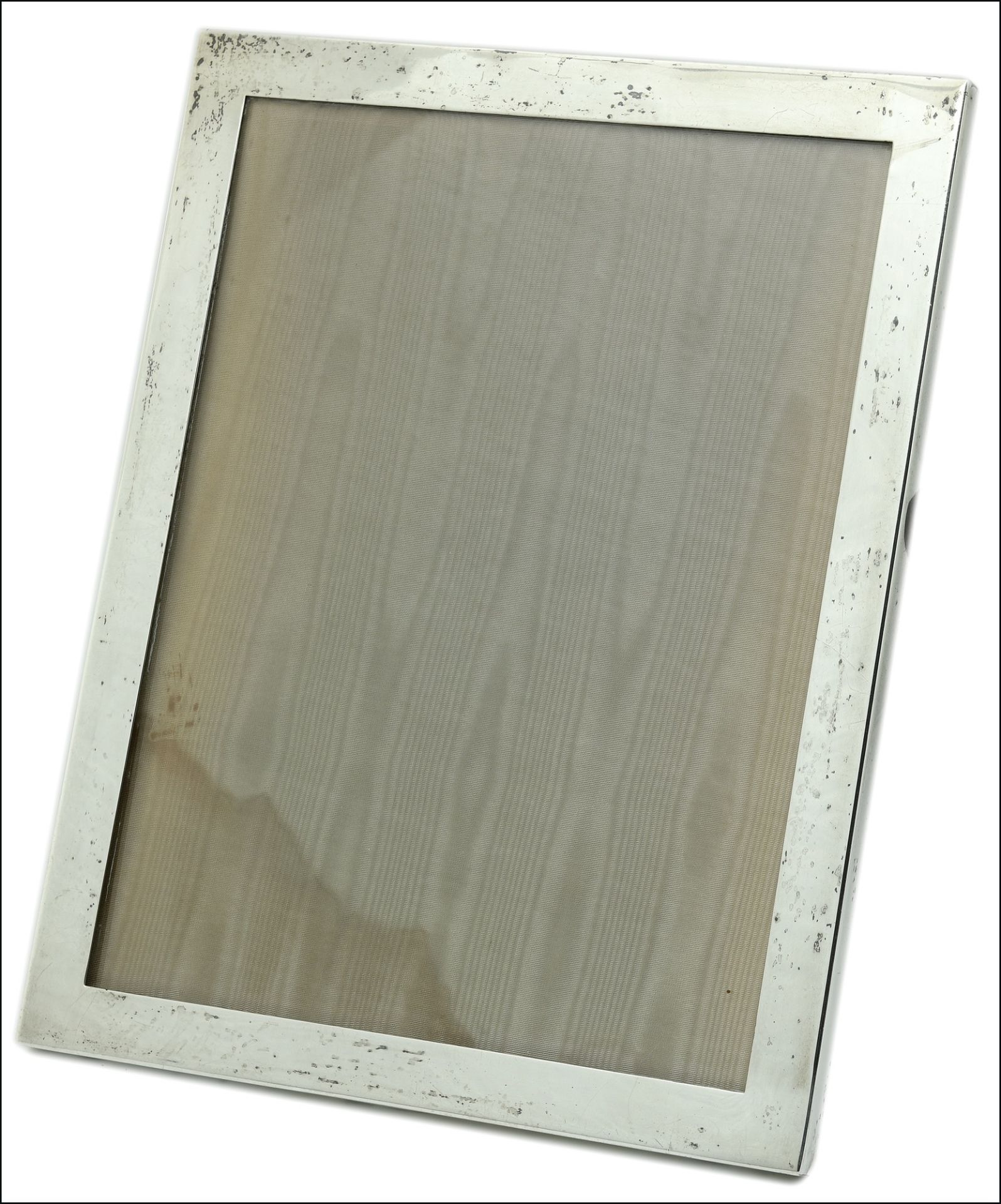 A photograph frame, of plain polished rectangular form, stamped ‘STERLING / 8S’, length 25.5cm. £
