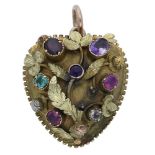 A gem-set acrostic pendant, circa 1830, the domed heart-shaped pendant supporting a foliate motif...