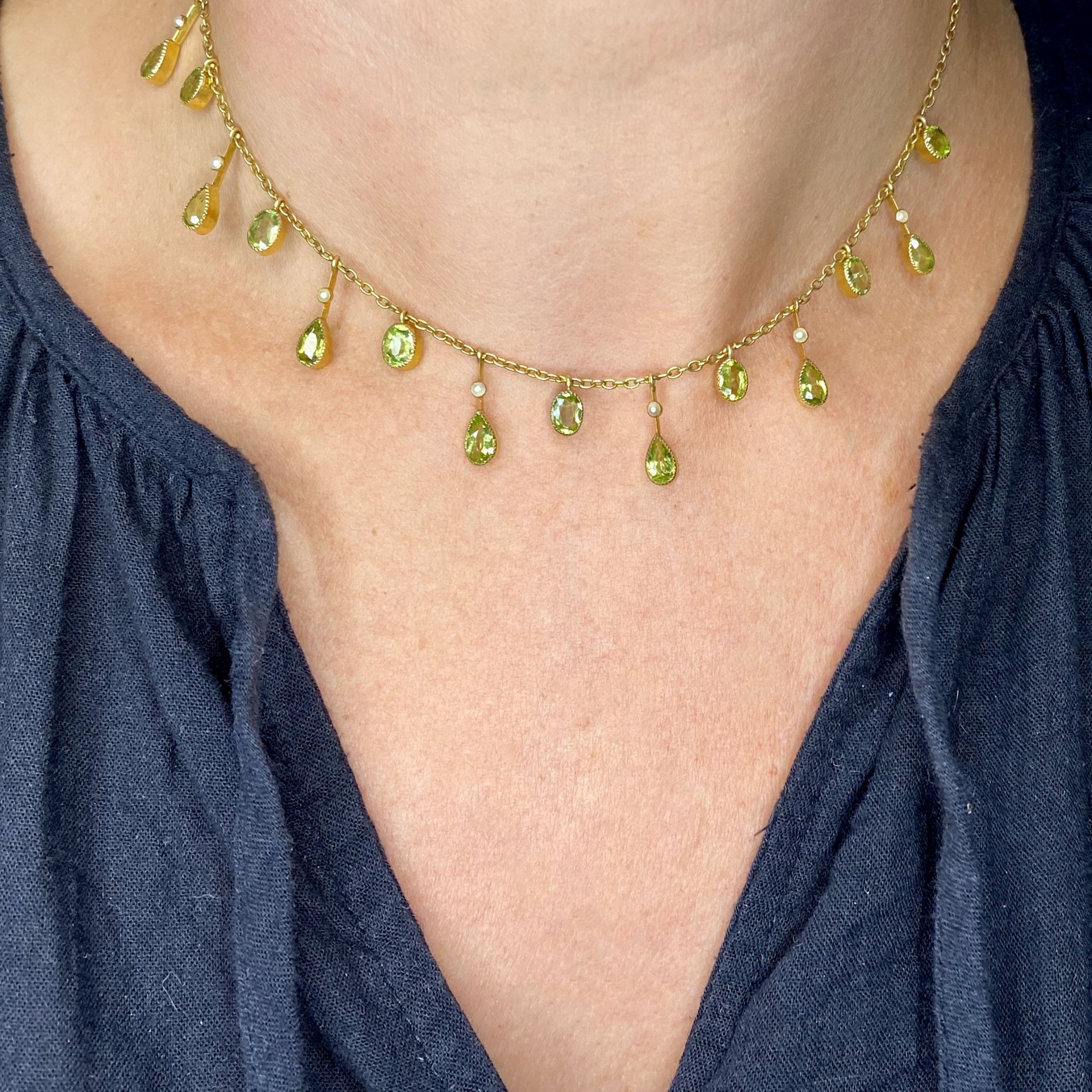 An early 20th century peridot and seed pearl fringe necklace, the belcher-link chain suspending k... - Image 4 of 4