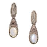 A pair of moonstone ear clips by Charmian Harris, the textured surmounts suspending bicoloured dr...