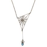 A 9ct gold spider web pendant by Murrle Bennett & Co., circa 1910, realistically modelled, the tu...