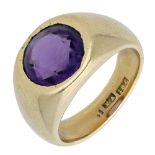 An amethyst ring, the circular-cut amethyst rubover set within a tapered mount, stamped â€˜18Câ€™, r