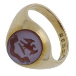 A hardstone signet ring by Goldsmiths and Silversmiths Co. Ltd., 1931, the oval banded agate with...