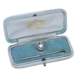 A pearl and diamond stick pin, circa 1890, comprising a gold mounted bouton-shaped pearl and old-...