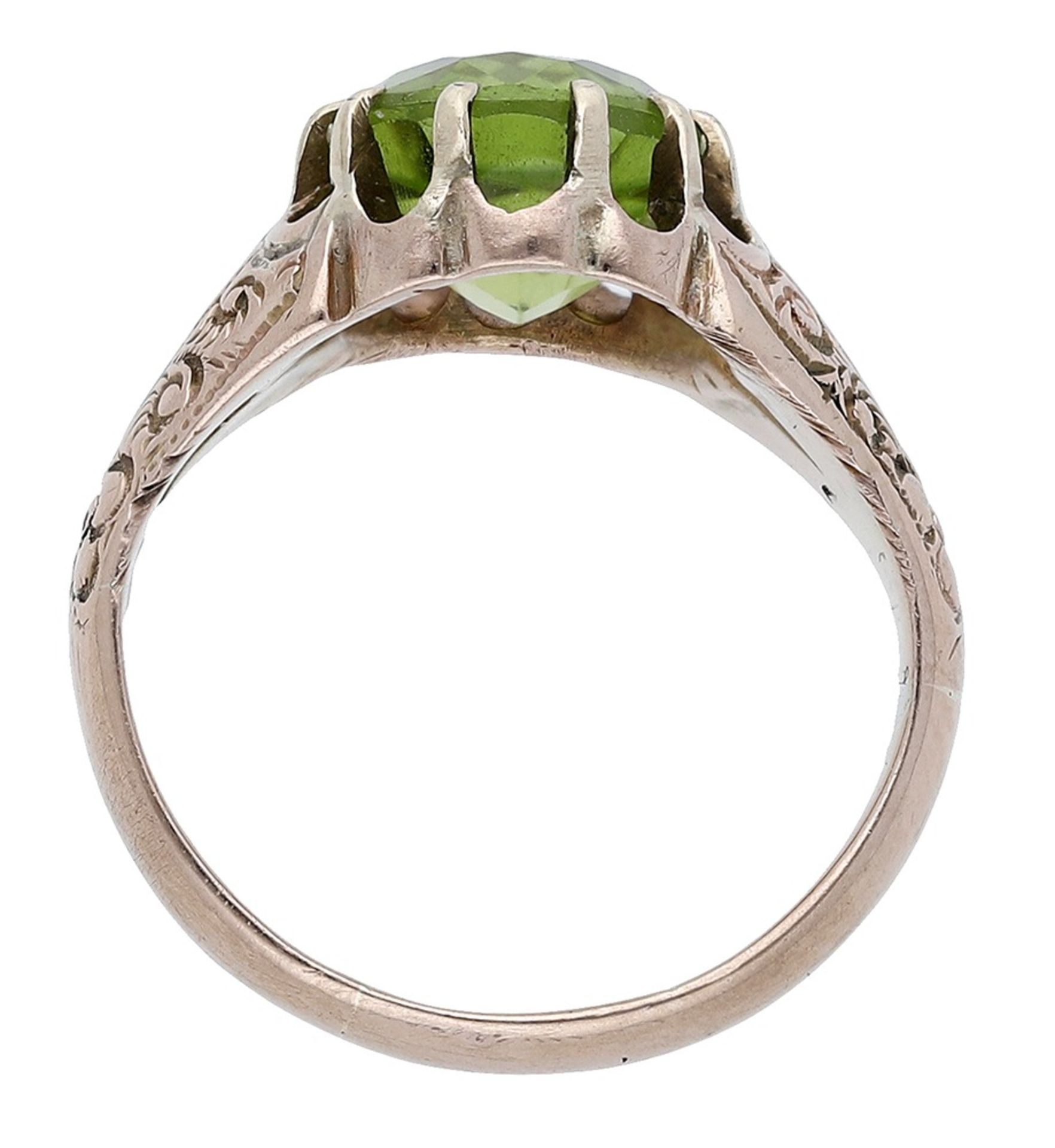 A peridot ring, 1913, the oval-cut peridot within a gold tapering mount engraved with foliate dec... - Image 2 of 3