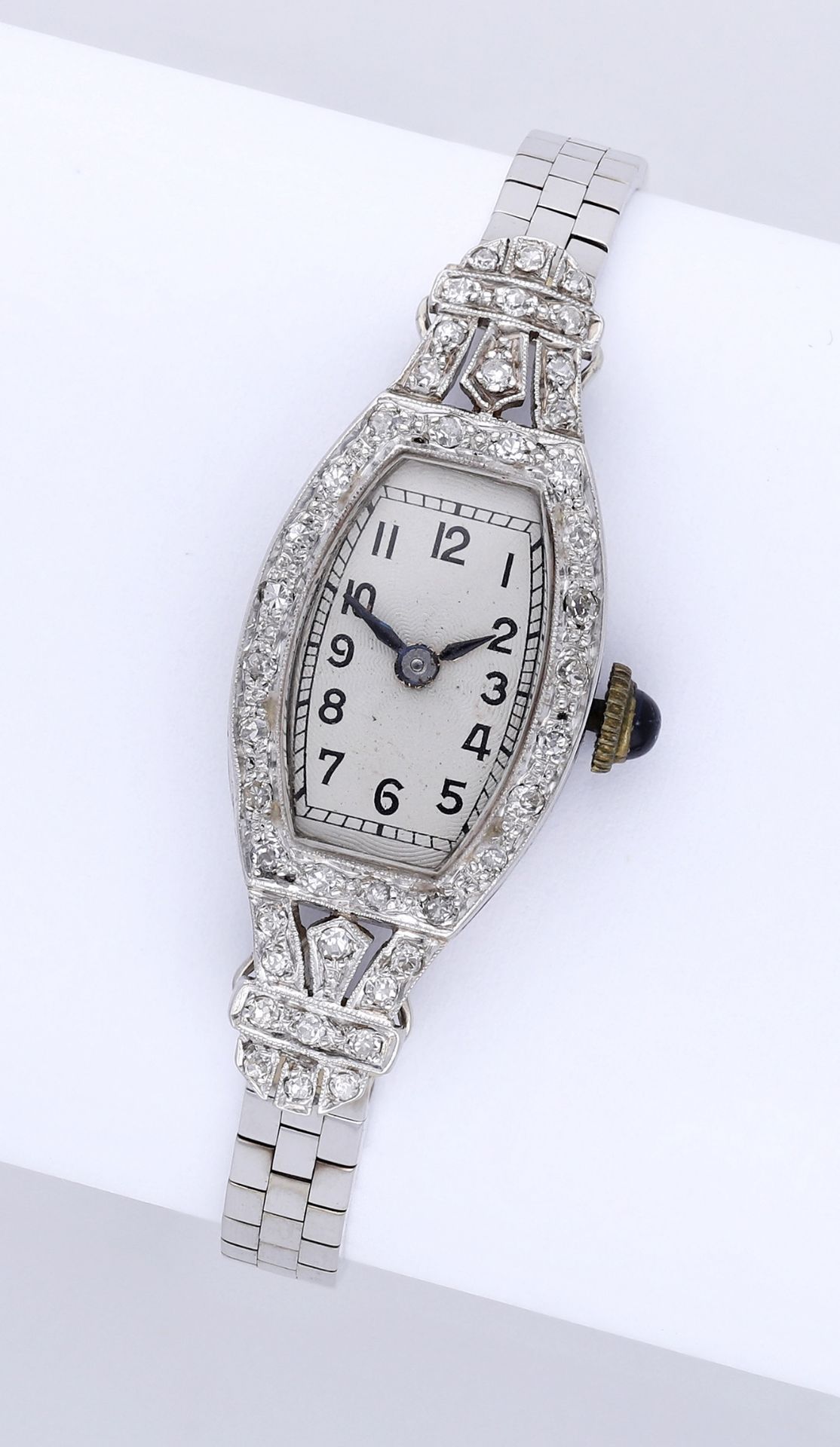 Swiss. A ladyâ€™s white gold and diamond-set cocktail watch, 1927. Movement: manual winding, lever..