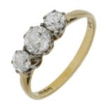 A diamond three stone ring, set with a graduated row of old brilliant-cut diamonds, mounted in 18...