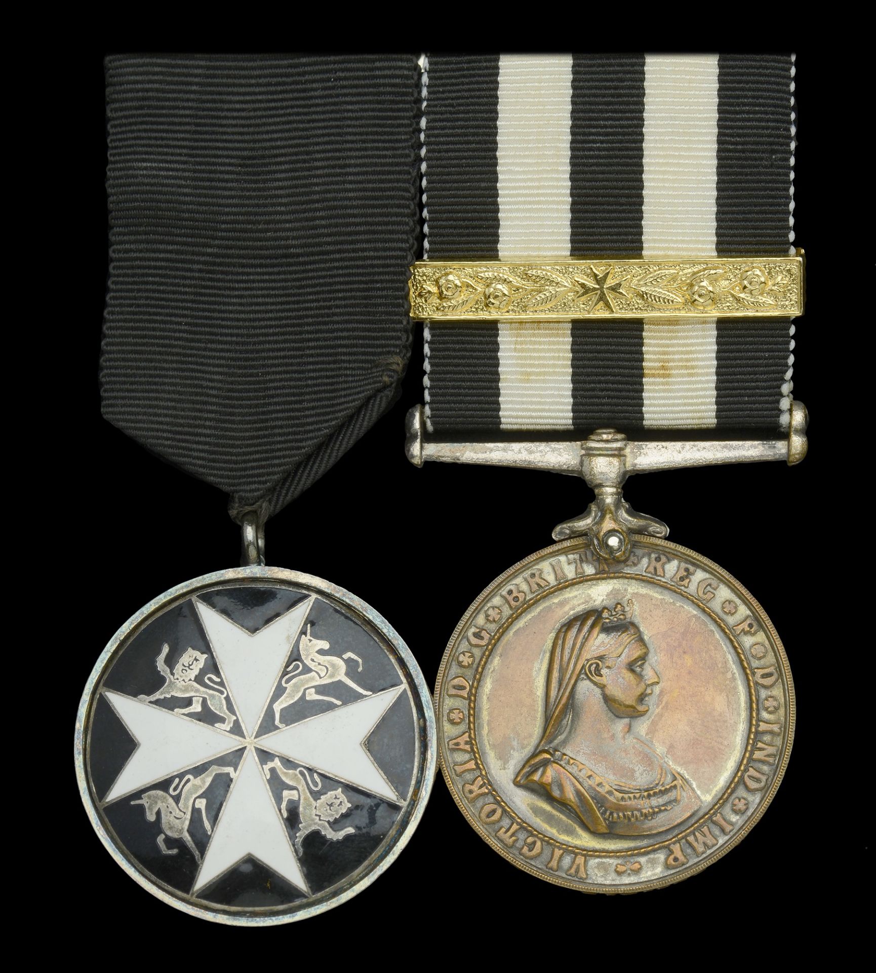 A post-War Order of St. John pair awarded to M. Herring, St. John Ambulance Brigade The O...