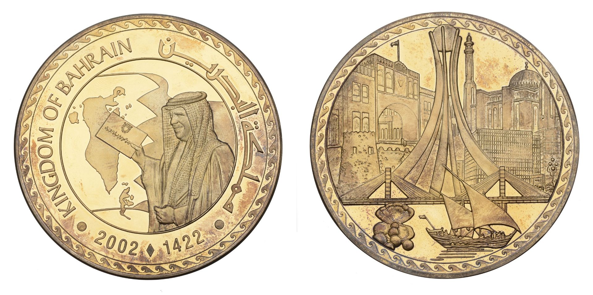 BAHRAIN, Announcement of the Kingdom of Bahrain, 2002, a gold-plated silver medal, unsigned,...