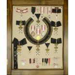 International, A framed display of 21 Orders, Decorations, and Medals from the Sovereign Mil...