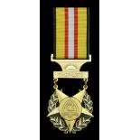 Timor-Leste, Republic, Medal of Merit, breast badge, gilt and enamel, unmarked, with related...