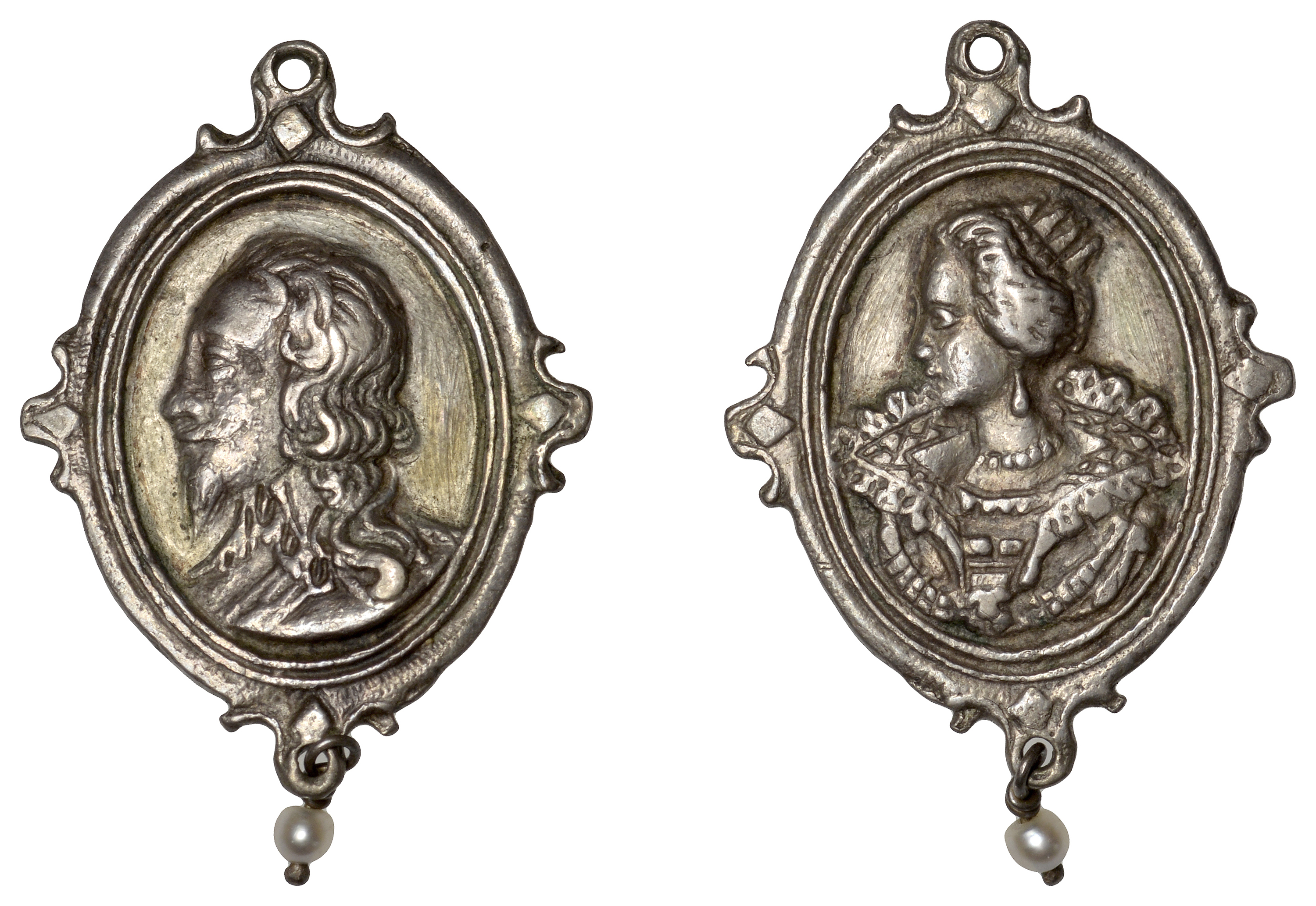 Charles I and Henrietta Maria, a cast and chased silver Royalist badge, unsigned [by T. Rawl...