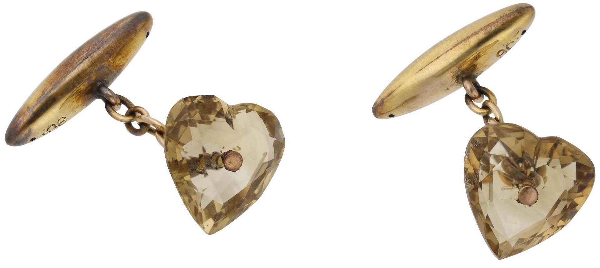 A pair of citrine cufflinks, the faceted heart-shaped citrines with hollow ovoid terminals,...