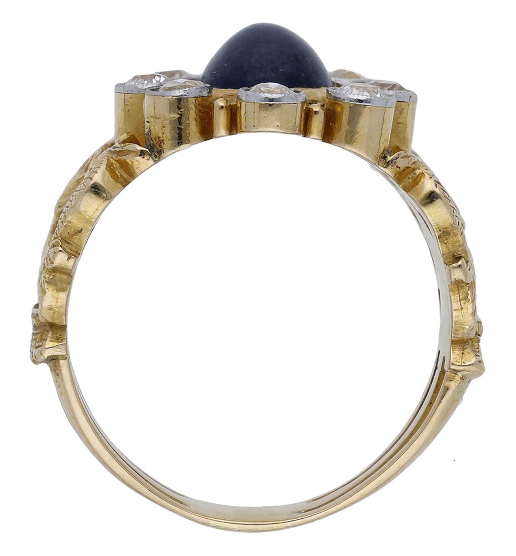 A sapphire and diamond ring, the oval sapphire cabochon within a surround of old brilliant-c... - Image 2 of 3