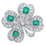 An emerald and diamond brooch, the early 20th century jewel designed as a four-leaf clover,...