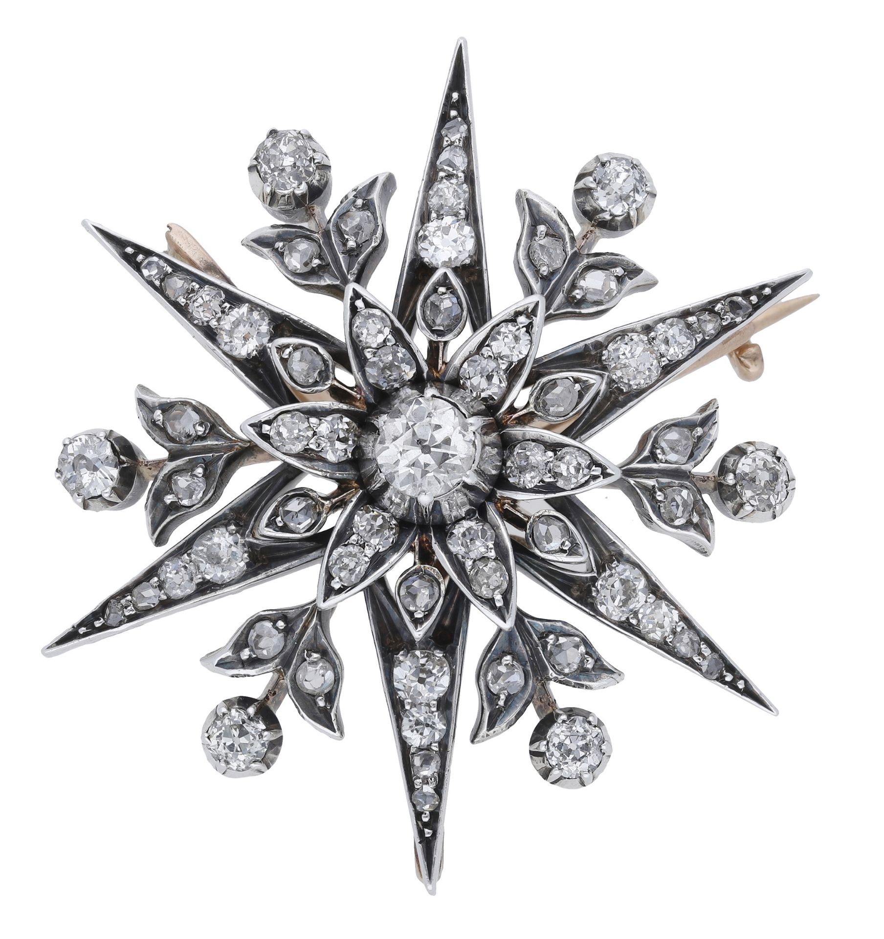A diamond star brooch, circa 1890, the stylised star with flowerhead and foliate detailing,...