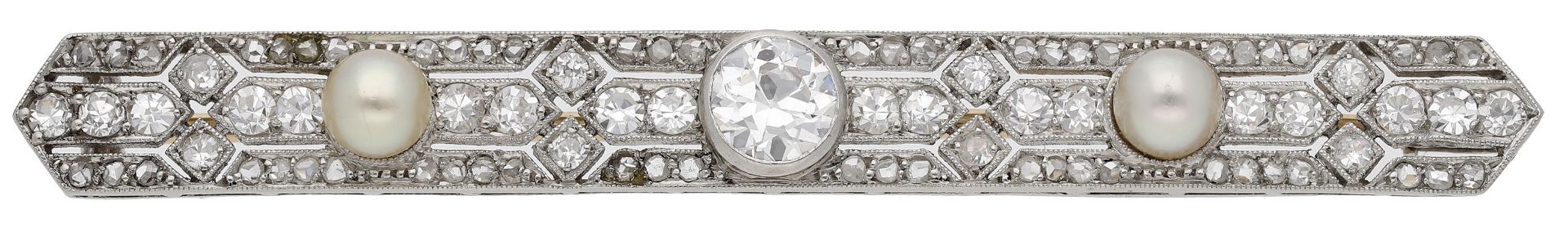 A pearl and diamond bar brooch, circa 1915, set with an old brilliant-cut diamond within a p...