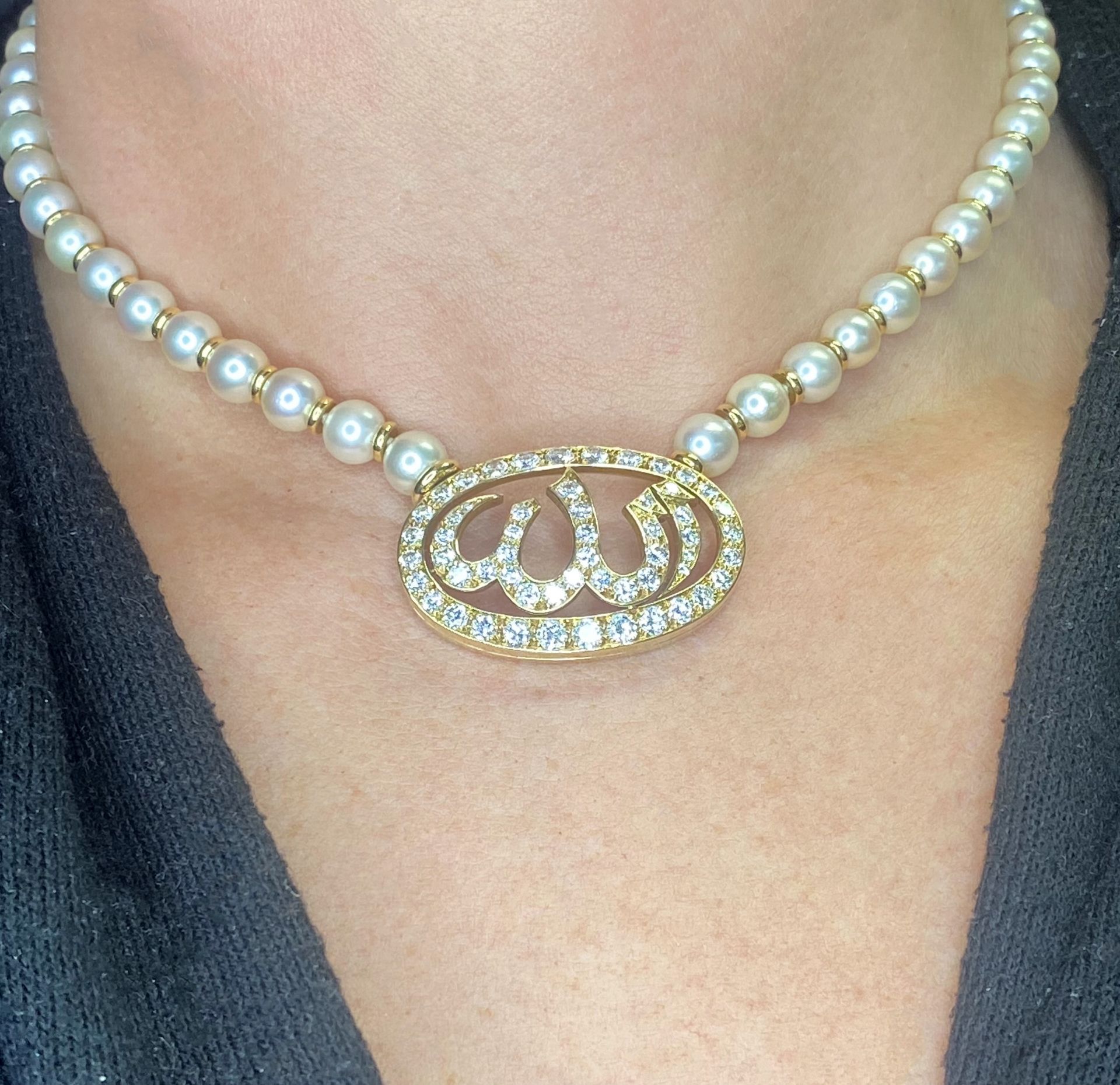 A cultured pearl and diamond necklace by Cartier, 1985, the slightly graduated cultured pear... - Image 5 of 5