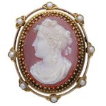 A late 19th century hardstone cameo brooch, the oval agate cameo carved to depict a classica...