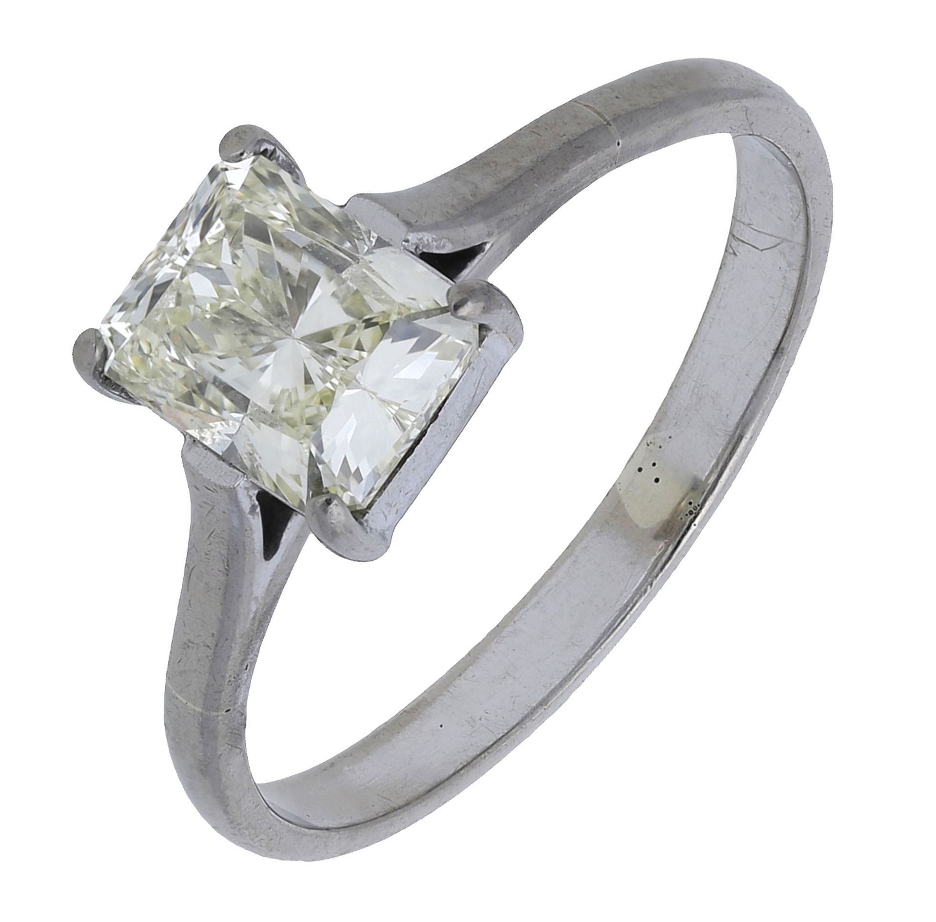 A diamond single stone ring, set with a cut-cornered diamond in a four claw setting, diamond...