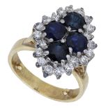 A sapphire and diamond cluster ring, the lozenge-shaped cluster comprising four circular-cut...
