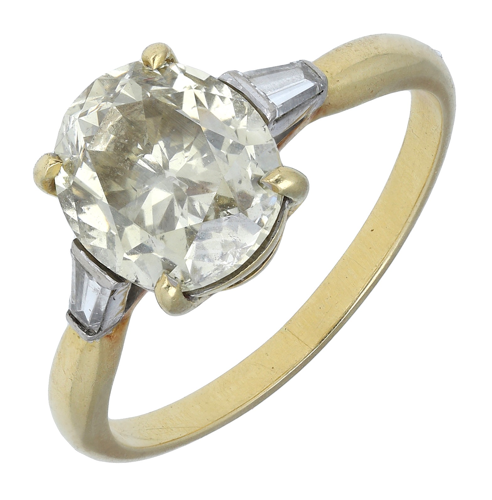 A diamond single stone ring, the oval-cut diamond of pale yellow tint and claw-set between t...