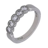 A platinum and diamond five stone ring, the brilliant-cut diamonds in millegrain settings, S...