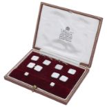 A 9ct white gold and mother-of-pearl gentleman's dress set, comprising a pair of cufflinks,...