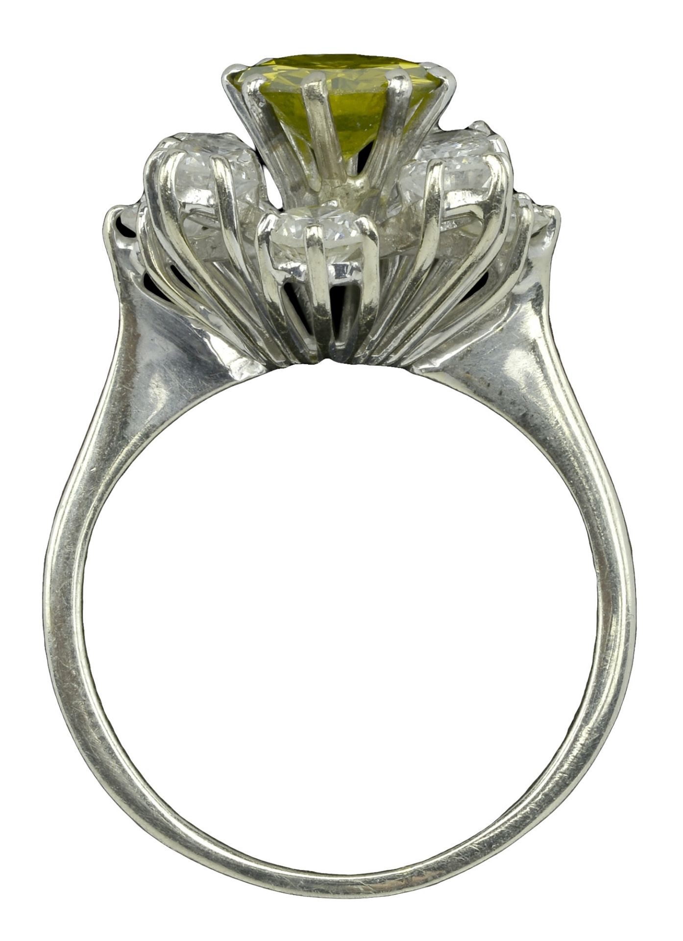 A diamond cluster ring, the central brilliant-cut diamond of yellow tint within an undulatin... - Image 4 of 5