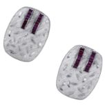 A pair of ruby cufflinks, the cushion-shaped plaques with brushed satin finish decorated wit...