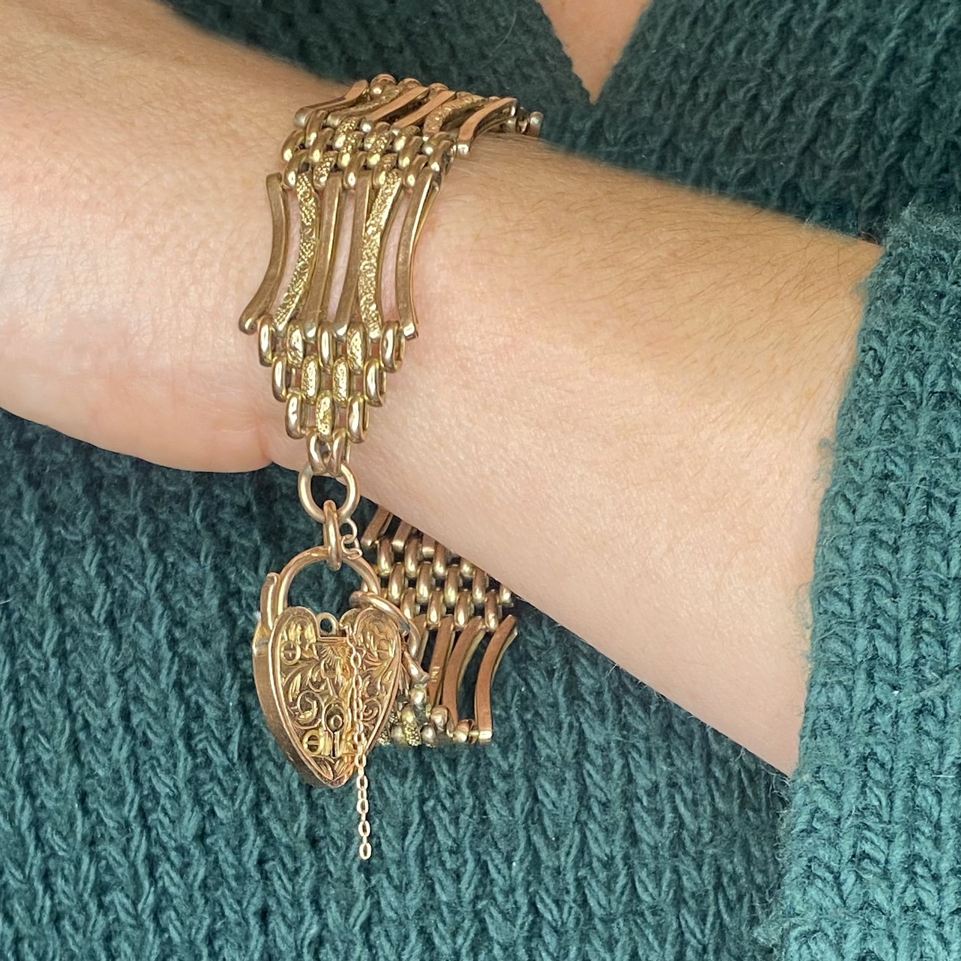 A gold gate-link bracelet, the fancy-link strap with textured decoration and heart-shaped pa... - Image 3 of 3