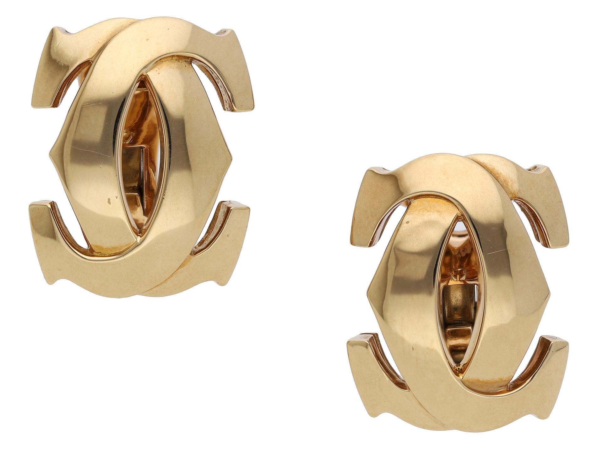A pair of 'Double C' ear clips by Cartier, of polished interlocking design, French assay mar...