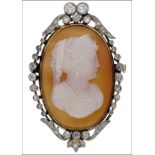 A late 19th century/early 20th century hardstone cameo and diamond brooch, carved to depict...