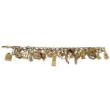 A gold charm bracelet, the 18ct gold bracelet suspending various charms to include a 9ct gol...